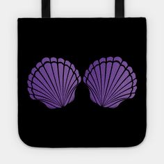 two purple seashells on a black background tote bag with the word sea shells printed on it