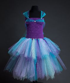 LAST DATE TO ORDER FOR CHRISTMAS  UK Wednesday 13th December  International ~ Sunday 10th December  Ariel ~ inspired by your favourite princess 👑 ️  Our beautiful mermaid tutu is made with yards of soft lilac, turquoise, purple and sparkly tulle finished off with delicate hologram discs. Shoulder straps are adjustable. PLEASE NOTE - As all of my dresses and skirts are made to order I cannot accept returns or exchanges so please double check the size you need when ordering or get in touch if you Mermaid Tutu, Girls Costumes, Beautiful Mermaids, Last Date, Girl Costumes, Ariel, I Dress, Lilac, Violet