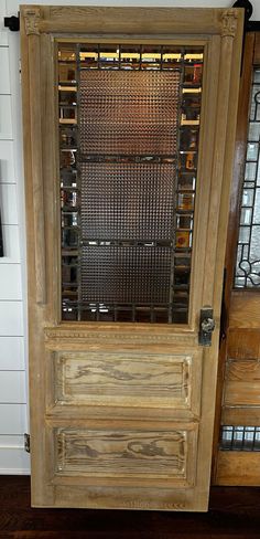 an old wooden door with glass inserts