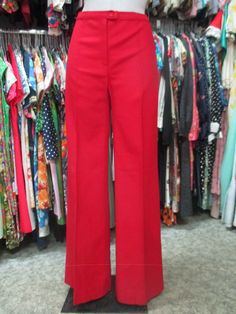 Original deadstock 70s flared red pants. NOS 70s trousers. Made in Italy. Woollen cloth. High waist and no pockets. Mint conditions. They fit about size 30 US Size 40 EU Measurements: (lay flat and double waist and hips) Waist 30"/77 cms rise 10.6"/27 cms hips 39.3"/100 cms inseam 33.4"/85 cms  bottom width 12.6" X 2/32 cms X 2 In order to avoid any unpleasant misunderstandings please read carefully all the items description before purchasing I measure all my items accurately and give the exact Fitted Red Wide Leg Pants, Red Wide Leg Fitted Dress Pants, Fitted Wide Leg Red Dress Pants, Red Fitted Wide-leg Dress Pants, Fitted Red Wide Leg Dress Pants, Vintage Red Pants For Fall, Retro Full-length Red Pants, Retro Red Full Length Pants, Red Retro Full-length Pants