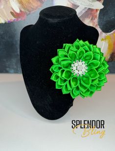 "This unique flower brooch is green with a pearl and rhinestone center piece.   Measures 4.25\" in diameter with alligator clip and/or pin style closure for clothing protection! Wear on your favorite lapel, dress, hat, or even in your hair! *Note - The color samples provided here may not be an exact representation of the product colors.  Various factors such as monitor resolution, color settings, photo edits and display type can affect color appearance." Elegant Green Flower Brooches, Green Flower-shaped Brooches For Weddings, Elegant Green Brooches With Handmade Flowers, Lapel Dress, Brooch Dress, Formal Accessories, Photo Edits, Paisley Tie, Dress Hat