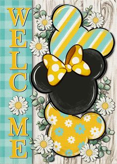 a mickey mouse welcome sign with daisies