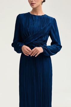 Indulge in the splendor of the Samara Pleated Wrap Waist Maxi Dress in Lapis Blue. This luxurious dress features an elegant plisse satin fabric, artfully pleated wrap waist, and a feminine ruffle hem. Elevate your style with this exquisite piece. Model is 5'7" and is wearing size XS/58". Elegant Wrap Dress, Pleated Satin Dress, Luxurious Dress, Plisse Dress, White Dress Formal, Dresses Flowy, Nikkah Dress, Makeup Wishlist, Maxi Dress Wedding Guest