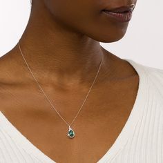 You'll enjoy the elegant details of this pear-shaped green lab-created emerald and diamond open frame teardrop pendant. Fashioned in cool 10K white gold This choice showcases a 7.0 x 5.0mm pear-shaped verdant-green lab-created emerald. A diamond-lined looped ribbon embraces the stone in a teardrop-shaped open frame. This design shimmers with 1/20 ct. t.w. of diamonds. The pendant suspends along an 18.0-inch rope chain that secures with a spring-ring clasp. Elegant White Gold Teardrop Emerald Necklace, Teardrop Diamond Emerald Necklace For Anniversary, Teardrop Emerald Necklace With Diamond For Anniversary, Elegant Teardrop Emerald And Diamond Necklace, Teardrop Emerald Gemstone Necklace For Formal Occasions, Green Briolette Emerald Necklace For Formal Occasions, Formal Green Briolette Emerald Necklace, Formal Briolette Green Emerald Necklace, Teardrop Emerald And Diamond Necklace