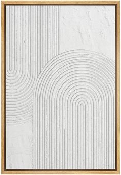 a white wall with a wooden frame on it and an abstract design in the middle