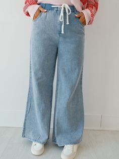 Experience versatility with the "Brio Wide Leg Denim Pants!" These pants are the ultimate piece to have on hand when it comes to styling fall outfits! They give the look of a classic pair of jeans, but with added comfort from the elastic and drawstring waistline! Complete with a lightweight denim fabric, wide leg design, as well as a zipper and button closure, these pants can really do it all! Detailed Fit: Drawstring at the waist with button and zipper Wide leg lightweight pant Side Pockets Ove Versatile Denim Bottoms For Fall, Relaxed Bottoms With Drawstring For Fall, Relaxed Drawstring Bottoms For Fall, Versatile Mid-rise Denim Pants, Versatile Dark Wash Cotton Flare Jeans, Everyday Cropped Leg Bottoms For Fall, Cropped Leg Bottoms For Fall Everyday Wear, Versatile Medium Wash Cropped Leg Bottoms, Light Wash Wide Leg Pull-on Bottoms