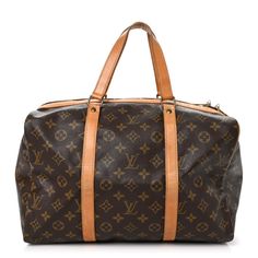 This is an authentic LOUIS VUITTON Monogram Sac Souple 35. This stylish bag is crafted of traditional Louis Vuitton monogram on toile brown canvas. The bag features vachetta cowhide leather trim includingstrap handles withbrass hardware. The top zippers open to a roomy cocoa fabric interior. Brown Canvas, Stylish Bag, Brass Hardware, Authentic Louis Vuitton, Leather Trim, Cowhide Leather, Leather Trims, Louis Vuitton Monogram, Cocoa