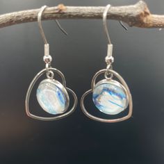 🌟 Welcome to Surf to Sky Studio, where each pair of jewelry is a wearable piece of art! 🎨 Handmade with Love and Originality: Our earrings are not just accessories; they are a statement of individuality. Crafted from original fluid art paintings, each pair is a one-of-a-kind masterpiece, ensuring that no two pairs are alike. The vibrant swirls and mesmerizing patterns reflect the beauty and unpredictability of fluid art, making each earring uniquely yours. Rhode Island Craftsmanship: As Rhode Island artisans, we take pride in our local craftsmanship. Each earring is meticulously handcrafted in our studio, infusing the spirit of the Ocean State's rich artistic and coastal heritage into every piece. Perfect for Every Occasion: Whether you're dressing up for a special event or accenting you Everyday Round Glass Jewelry, Minimalist Metal Clip-on Earrings For Gift, Minimalist Glass Dangle Jewelry, Nickel Free Glass Jewelry In Minimalist Style, Everyday Glass Drop Earrings, Everyday Glass Dangle Jewelry, Minimalist Nickel-free Glass Jewelry, Everyday Silver Glass Jewelry, Artistic Heart-shaped Dangle Earrings For Gift