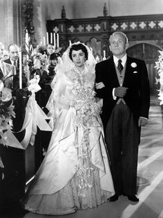 an old photo of a bride and groom walking down the aisle at their wedding ceremony