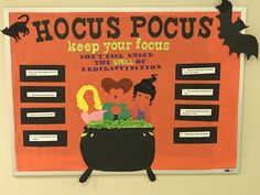 a bulletin board with some writing on it that says hoccus pocus keep your focus