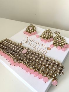 This beautiful silver and gold set that comes with earrings and tikka.  Please follow our Instagram page  @sakavano_jewellery for all our latest offers.  Please note we do not offer any refunds or exchanges due to hygiene reasons. Elegant Pink Kundan Jewelry Sets, Elegant Pink Kundan Sets, Pink Stone Work Necklaces For Party, Pink Stone Work Necklace For Party, Heavy Pink Bridal Necklace For Diwali, Traditional Pink Bridal Necklace For Party, Pink Kundan Tikka For Festivals, Pink Kundan Necklace With Stone Work For Party, Festive Pink Kundan Necklace For Party