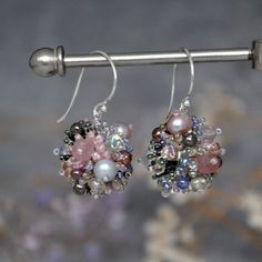 Introducing our stunning hand beaded dangle ball earrings.  These earrings are designed to make a statement with their unique combination of materials and intricate beading.  The smaller size compared to our bestselling ball earrings makes them perfect for everyday wear. Despite the delicate appearance, these earrings are lightweight and comfortable to wear all day long. The earrings feature a blend of moonstone, faceted strawberry quartz, agate, Japanese seed beads, freshwater pearls and other Unique Wire Wrapped Beaded Earrings With Round Beads, Handmade Elegant Spherical Jewelry, Elegant Round Beaded Earrings With Colorful Beads, Unique Sterling Silver Beaded Earrings, Elegant Round Beaded Earrings, Elegant Bead Caps Drop Earrings Jewelry, Party Beaded Wire Wrapped Round Earrings, Wire Wrapped Beaded Earrings For Party, Colorful Beaded Earrings In Sterling Silver