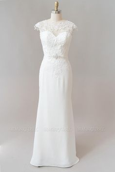 a white wedding dress on a mannequin