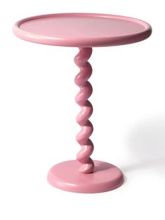 a small pink table with an odd design on the top and bottom, against a white background