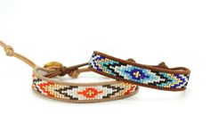 two beaded bracelets on a white background