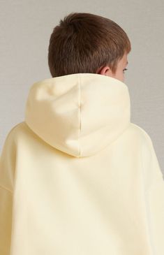 The Kids Fear of God Essentials Garden Yellow Hoodie features a relaxed fit, a mock neckline, long sleeves, side seam pockets, an attached hood, and a rubber brand label at the center front and upper back.


	Solid color hoodie
	Attached hood
	Long sleeves
	Mock neckline
	Side hand pockets
	Front & back rubber brand labels
	Ribbed cuffs and hem
	Relaxed fit
	80% cotton, 20% polyester brushed back heavyweight fleece
	Hand wash, flat or line dry


Fear of God Essentials are fina Hoodie Scarf, Beauty In Art, Organic Cotton Yarn, Fear Of God Essentials, Yellow Hoodie, Fear Of God, Mock Neckline, Cotton Hoodie, Black Love