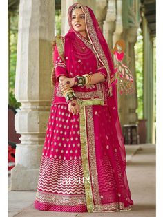 Humrahi Pure Wedding Partywear Rajputi Poshak In Pink Color Product Details: Fabric: Humrahi Pure with Contrast Humrahi Pure Odhna Work: 10 kali hand work style of antique codding & jari with full kundan Hevy Odhni 4side+Jaal Desiner work with Pallu butta & gotta kiran turii Kurti with heavy baju & gala workWith work magji Color Family: Pink Style:Rajasthani, Rajputana Occasion:Festive, Traditional,Wedding Washing Instruction:Dry Wash The Semi-stitched Lehenga Waist and Hips are Customizable fro Meenakari Choli For Reception And Festivals, Meenakari Dupatta For Reception And Diwali, Reception Dupatta With Meenakari For Diwali, Meenakari Dupatta For Reception During Diwali, Bollywood Style Sharara For Wedding During Navratri, Meenakari Sharara For Reception And Navratri, Semi-stitched Meenakari Sets For Reception, Semi-stitched Traditional Wear With Meenakari For Reception, Meenakari Saree For Reception And Navratri