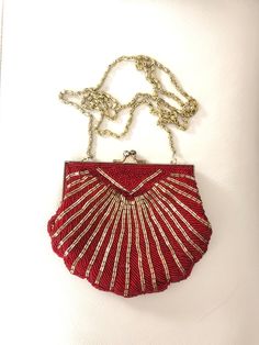 Just as shown. In lovely vintage condition. Measurements in photos for simplicity. Drop chain measures 21.5 inches long. Can be worn cross body style or over the shoulder. Purchaser pays shipping. Thanks for shopping by! Red Beaded Evening Bag, Red Vintage Evening Bag For Formal Occasions, Vintage Red Rectangular Evening Bag, Vintage Red Bags For Wedding, Vintage Red Wedding Bag, Vintage Red Wedding Bags, Light Up Tree Topper, Red Clutch, Luxury Purses