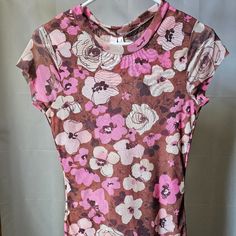 Nwt Sweet Pea By Stacy Frati Floral Top. Pink, Brown, And White Flowers On A Stretch Tight Mesh Fabric. New, Never Worn, Perfect Condition. Size Is Xl, But It Looks Pretty Small! 2 Layers Of Fabric Front And Back. Unfinished Edge Cap Sleeves. 100% Nylon. Hand Wash Cold. 15" Across The Front Measured Just Under Where The Sleeves Meet The Body. Stretches To About 18" 26" Long. Brown And White Flowers, Body Stretches, White Floral Top, Sweet Pea, Floral Top, Pink Brown, Mesh Fabric, How To Look Pretty, White Flowers