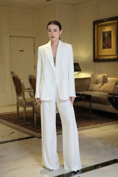 The pants appear impressively with a unique side pleated design that makes the item more elegant in a classic white. Wide legs form combined with high-quality silk material will bring a flowing and airy feeling to the wearer when wearing. Note:*Processing time takes 8-10 working days (including 5-7 working days for manufacturing and NOT including shipping time)**Backorder Definition- The product is low in stock and in case the customer purchased successfully after out of stock, the order will ne White Blazer White Pants Outfit, White Blazer And White Pants Outfit, Bride In Pants, Pantsuits For Women Casual, White Suit Outfit, White Pants Suit, Silk Pants Outfit, White Trousers Outfit, Wedding Suit Women