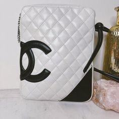 Please Note: Bag Has Been Meticulously Cleaned And Conditioned, White/Ivory Has Been Recolored At Corners And Places Where It Was Previously Badly Stained/Discolored. Black Leather Has Not Been Recolored In Any Way. Almost-Vintage Rare Chanel Bag, Cambon Ligne Crossbody In White/Ivory Quilted Lambskin Contrasted With Black Leather Cc, Strap, And Corner Accent. Double Crossbody Strap That Is Knotted In Attachment To Bag. Silver Zipper Pull Stamped With Chanel. Interior Pink Fabric Lining, Serial White Luxury Shoulder Bag With Mobile Phone Holder, Chanel Interior, Chanel Crossbody Bag, Chanel Crossbody, Bag Silver, Silver Zipper, Quilted Leather, Pink Fabric, Crossbody Strap