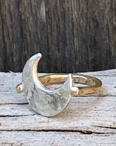 "Cast Hammered Sterling Silver Crescent Moon Ring with 14K Gold Fill Band The Crescent Moon is 9/16\" across. There is a larger version that is 3/4\" across. I recommend the larger version for size 8 and up. It is listed as Silver Hammered Large Moon Ring with 14K Gold Fill Band." Cosmic Jewelry, Lunar Jewelry, Crescent Moon Jewelry, Silver Promise Rings, Crescent Moon Ring, Moon And Star Ring, Brown Leather Bracelet, Ring Trends, Moon Ring