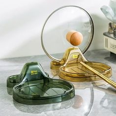 a magnifying glass sitting on top of a table next to a metal object