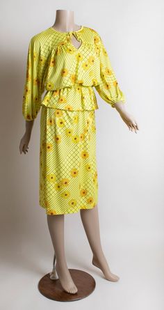 FREE DOMESTIC SHIPPING! <3♥ Lovely 1970s bright yellow daisy flower & striped, two piece blouse & skirt set! ♥ Pullover blouse, has a peplum skirt, elastic waist for comfy fit! Billowy sleeves with elastic cuffs. Keyhole neckline! ♥ Straight pencil style skirt with an elastic waist. ♥ In great condition! Two small runs on back of blouse, see last photo. Georgee Originals, tag. Polyester.* measurements *Bust - 42"Shoulders - 16"Waist - up to 28"Hips - 44"Blouse Length - 23"Skirt Length Vintage Retro Print Skirt For Spring, Vintage Skirt With Retro Print For Spring, Spring Vintage Skirt For Vintage Fashion, Vintage Fashion Skirt For Spring, Spring Vintage Fashion Skirt, 1970s Style Yellow Spring Dress, Vintage Yellow Fitted Skirt, Fitted Vintage Yellow Skirt, Mid-century Yellow Dresses For Spring