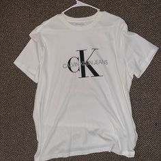 Large Size , Great Condition, Brand New Without Tags Calvin Klein White Logo Print T-shirt, Calvin Klein Cotton Tops With Logo Print, White Calvin Klein Crew Neck T-shirt, Calvin Klein White Crew Neck T-shirt, Calvin Klein White T-shirt For Streetwear, Calvin Klein White Short Sleeve Shirt, Calvin Klein Casual Short Sleeve Shirt, Calvin Klein White Short Sleeve Top, Calvin Klein White Relaxed Fit T-shirt