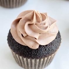 a chocolate cupcake with frosting on top