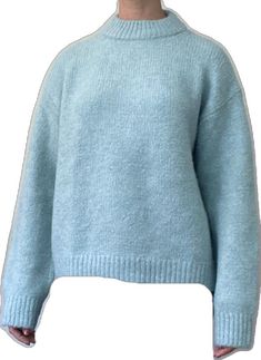 Blue Funnel Neck Winter Sweater, Blue Sweater With Ribbed Cuffs For Winter, Blue Funnel Neck Sweater For Winter, Light Blue Sweater For Winter Layering, Oversized Blue Turtleneck Sweater, Soft Knit Light Blue Winter Sweater, Blue Soft Knit Crew Neck Sweater, Light Blue Crew Neck Winter Sweater, Light Blue Crew Neck Sweater For Winter