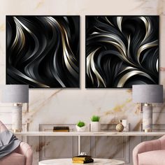 two black and gold paintings in a living room