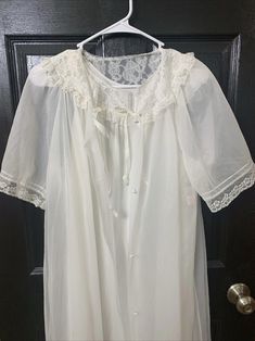 Beautiful vintage Lorraine peignoir set. Chiffon robe and matching nightgown- white. Lace at the neck and shoulders. Very Flowy and graceful. No tears. No holes. There is one very tiny discoloration on the left sleeve of robe. Please see photos. Vintage White Nightgown For Wedding Night, Vintage White Robe For Daywear, Vintage White Daywear Robe, White Vintage Robe For Daywear, Vintage White Wedding Sleepwear, White Lace Trim Gown For Daywear, Vintage White Wedding Robe, Vintage White Sleepwear For Loungewear, White Sheer Robe For Daywear