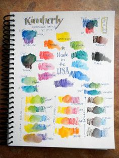 a notebook with some watercolors on it and the words kentucky written in different colors