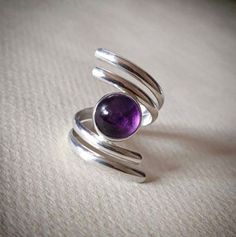 Welcome To My Shop  Natural Amethyst Ring, Handmade Dainty Ring, 925 Sterling Silver Ring, Round Amethyst Ring, Gift for her, February Birthstone, Promise Ring Handmade item Ships from a small business in India Gemstone: Amethyst  Gem color: Purple Band color: Silver Style: Boho & hippie Natural Amethyst Ring, Handmade Dainty Ring, 925 Sterling Silver Ring, Round Amethyst Ring, Gift for her, February Birthstone, Promise Ring Made of 925 sterling silver Gemstone: Amethyst Metal: 925 sterling silver US Ring Size: Choose Size Main Stone Creation: Natural * This Ring Is handmade and made with Love and Care in our workshop * This Ring Is Made To Order * This Ring Is made to order. Our turn around time is about 6 - 10 business days. How to care for sterling silver Jewelry Keep your jewelry away Adjustable Silver Amethyst Ring In Sterling Silver, Adjustable Hallmarked Silver Amethyst Ring, Sterling Silver Cabochon Amethyst Ring Gift, Adjustable Purple Cabochon Ring, Purple Sterling Silver Crystal Open Ring, Purple Sterling Silver Open Crystal Ring, Sterling Silver Amethyst Cabochon Ring, Silver Amethyst Cabochon Ring In Sterling Silver, Sterling Silver Amethyst Ring With Cabochon