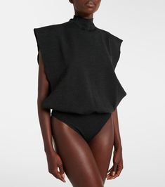 Wool bodysuit in black - Alaia | Mytheresa High Neck Bodysuit For Workwear In Fall, Fall Workwear Bodysuit With High Neck, Fall Workwear High Neck Bodysuit, High Waist Bodysuit For Work, Chic Fall Workwear Bodysuit, Chic Fall Bodysuit For Workwear, Chic Sleeveless Bodysuit For Fall, Winter Workwear Turtleneck Bodysuit, Winter Turtleneck Bodysuit For Workwear