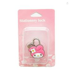 a pink hello kitty keychain with a hello kitty lock on it's side