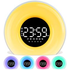 an alarm clock with four different colors around it and the time displayed on each side