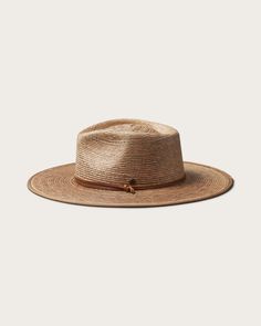 Discover the perfect blend of style and practicality with our Morro Fedora, handwoven by artisans from 100% tripilla palm straw. This lightweight accessory features a low depth fedora crown and an adjustable leather drawstring, making it an ideal choice for beachgoers and pool loungers alike. Adjustable Coastal Straw Hat Made Of Toquilla, Braided Flat Brim Panama Hat In Natural Color, Artisan Natural Panama Hat For Vacation, Woven Toquilla Straw Hat With Flat Brim, Brown Toquilla Straw Sun Hat With Flat Crown, Handwoven Toquilla Straw Panama Hat For Travel, Brown Flat Crown Straw Hat For Vacation, Summer Panama Hat With Flat Crown For Everyday, Natural Straw Hat For Everyday Summer Use