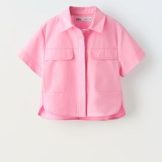 Short Sleeve Polo Shirt. Front Button Closure Hidden By A Flap. Flap Appliqus At Chest. Bubble Gum Outer Shell 100% Cotton Which Has At Least: Outer Shell 65% Ocs Certified Organically Grown Cotton Oversized Pink Blouse With Pockets, Oversized Pink Shirt With Pockets, Relaxed Fit Tops For School In Spring, Trendy Zara Cotton Shirt, Zara Pink Cotton Shirt, Pink Cotton Zara Shirt, Zara Shirt With Pockets For Spring, Pink Short Sleeve Tops With Placket, Spring Button-up Shirt For School