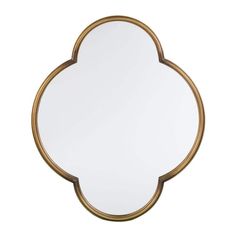 an oval mirror with gold trim around the edges and a white backround in the middle