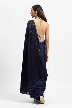 Navy blue saree embroidered with glass bugles and crystals in geometric patterns. Comes with a running blouse piece. - Aza Fashions Hand Embellished Georgette Pre-draped Saree, Semi-stitched Embellished Blue Saree, Hand Embellished Semi-stitched Pre-draped Saree In Georgette, Hand Embellished Semi-stitched Georgette Pre-draped Saree, Bollywood Style Hand Embellished Saree, Embellished Blue Saree For Diwali, Traditional Blue Pre-draped Saree With Sequins, Traditional Hand Embellished Pre-draped Saree For Diwali, Diwali Hand Embellished Traditional Drape Saree