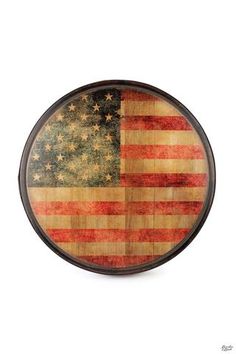 an american flag painted on a wooden plaque