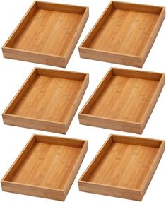 four wooden trays sitting on top of each other