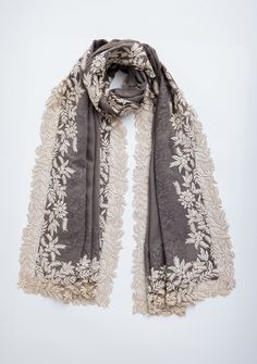 Embrace the understated sophistication of our mousse-colored cashmere scarf, elegantly detailed with a contrasting ivory leaf embroidery border that adds a touch of natural charm. The delicately handcrafted tonal floral lace inset elavated the overall design, subtly creating a harmonious blend of texture and refined beauty. Luxuriously soft and warm, this scarf is perfect for layering in any season, whether for a casual day out or a formal event. Add this versatile and timeless piece to your col Luxury Elegant Shawl With Intricate Embroidery, Luxury Pashmina Shawl With Intricate Embroidery, Luxury Elegant Scarves With Chikankari Embroidery, Embroidery Border, Lace Scarf, Lace Inset, Cashmere Scarf, Steel Blue, Timeless Pieces