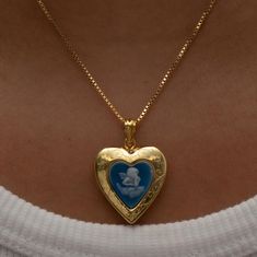 The Blue Angel Photo Locket Necklace This item is handmade to order. Please click the ‘SHIPPING’ bubble for more information on turnaround times. The locket is fully functional, with an option to include a photo! Metal: 18KT Gold Vermeil Chain type: Box Length: 16" total Locket Size: 0.75" NOTE: Please do not get your lockets wet or submerge them in water. As these items include paper goods, we will not be liable for any water damage that can ruin your photo. *Any items purchased with a discount Vintage Dainty Jewelry, Blue Jewelry Aesthetic, Blue And Gold Aesthetic, Vintage Gold Necklace, Photo Locket Necklace, Blue Angel, Heart Locket Necklace, Dope Jewelry, Ținută Casual