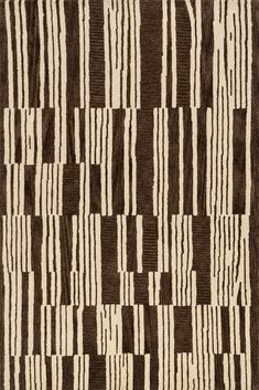 a brown and white rug with stripes on it