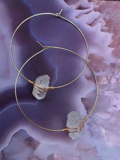 These gorgeous Clear Quartz wire wrapped healing crystal hoop earrings are a minimalist style perfect in your healing, meditative or sacred space to create a soothing, serene, and spiritual vibe. ॐ These beauties are lightweight and feature a removable silicone earring back for secure wear! This breathtaking bohemian style is available in 3 different sizes , 1" , 1 1/2" or 2" inches in diameter. Also available in stainless silver steel or brass gold. These raw natural earrings make a great gift Minimalist Adjustable Crystal Earrings, Minimalist Crystal Earrings For Gift, Minimalist Handmade Hoop Wrap Earrings, Minimalist Wire Wrapped Round Hoop Earrings, Minimalist Wire Wrapped Hoop Earrings, Minimalist Wire Wrapped 14k Gold Filled Hoop Earrings, Minimalist Dangle Crystal Earrings, Minimalist Wire Wrapped Crystal Dangle Earrings, Adjustable Hoop Earrings With Spiritual Style