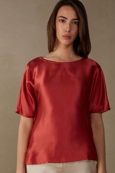 Kimono cut top with short, elbow-length sleeves and rounded boat neckline. The front is in pure silk satin and the back is in soft modal. Side vents. Loose fit.
The model is 5’ 9” (175 cm) tall and is wearing a size 2 / S.

The silk in this piece is bluesign® certified. Elegant Short Sleeve T-shirt For Evening, Formal Short Sleeve Viscose Blouse, Formal Short Sleeve Viscose Tops, Evening Fitted Short Sleeve T-shirt, Fitted Short Sleeve T-shirt For Evening, Elegant Short Sleeve Silk Top, Elegant Silk Crew Neck Top, Formal Silk Short Sleeve Tops, Evening Satin Short Sleeve Blouse