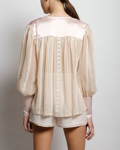 Silk Tops With Lace Trim For Daywear, Silk Chiffon Top With Sheer Long Sleeves, Feminine Sheer Sleeves Top For Daywear, Feminine Silk Top With Sheer Sleeves, Feminine Silk Tops With Sheer Sleeves, Cream Satin Long Sleeve Blouse, Chic Puff Sleeve Blouse With Lace Cuffs, Feminine Blouse With Blouson Sleeves For Evening, Feminine Silk Chiffon Blouse For Spring